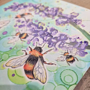 Close-up of Bumblebee and Lavender ceramic trivet showing embossed bumblebee and lavender design detail with teal bubble-effect background