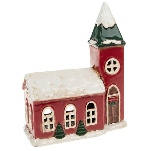Village Pottery Christmas church tealight house large, red building with snow-covered roof, arched windows, tall bell tower with green spire, Christmas trees at base and wreath on door, white background
