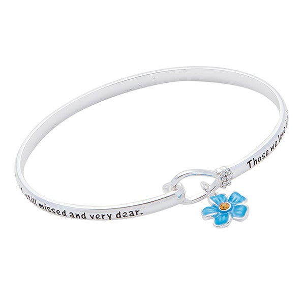 Close-up of Forget Me Not silver plated bangle showing blue flower charm detail
