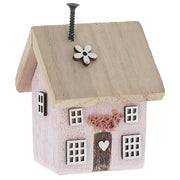 Spring Folk Art Cottage House ornament in pink pastel with flower and heart cut-out detail