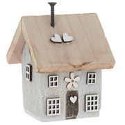 Spring Folk Art Cottage House ornament in grey pastel with flower and heart cut-out detail