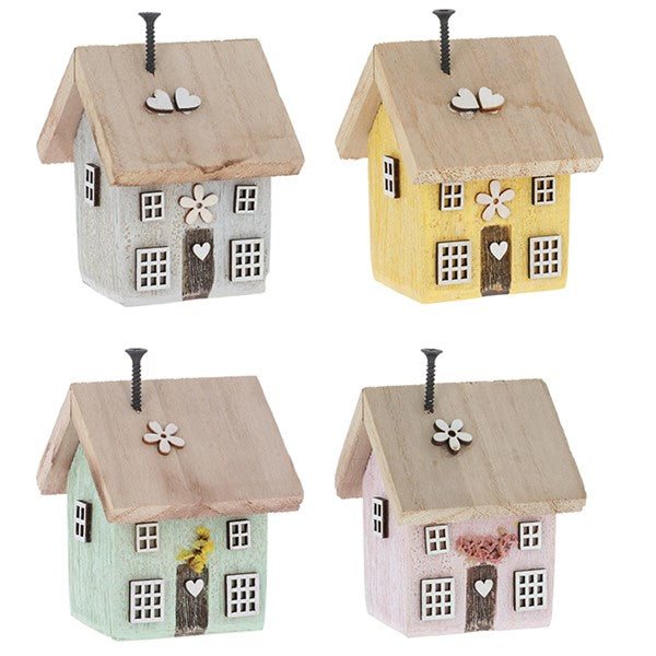 Spring Folk Art Cottage House ornaments in four pastel colours — grey, yellow, mint and pink — with wooden flower, wonky windows, heart, and screw chimney details