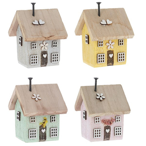 Spring Folk Art Cottage House ornaments in four pastel colours — grey, yellow, mint and pink — with wooden flower, wonky windows, heart, and screw chimney details