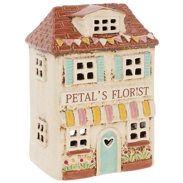 Handcrafted ceramic florist shop tealight holder with pale blue door, pastel awning and floral window boxes, from Shudehill Village Pottery Cottage Collection