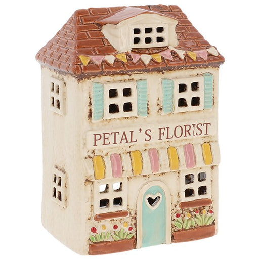 Handcrafted ceramic florist shop tealight holder with pale blue door, pastel awning and floral window boxes, from Shudehill Village Pottery Cottage Collection