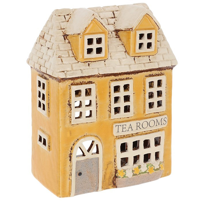 Village Pottery Tea Rooms tea light holder, hand-painted ceramic two-storey mustard yellow building with slate-effect tiled roof, dormer windows, arched door and Tea Rooms signage with yellow flower window box