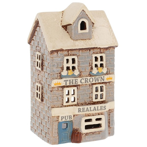 Village Pottery Crown Pub ceramic tealight holder with blue door, real ale sign and floral frontage, front view on white background