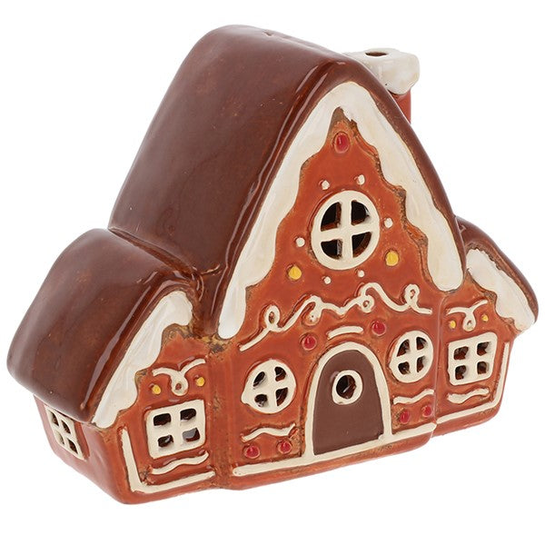 Village Pottery large gingerbread house tealight holder with wide triple-pitched roof, icing trim and swirl details, arched door, round and square cut-out windows on the front and sides, candy dot details and side chimney