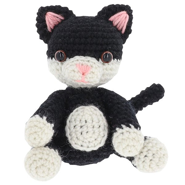 Close-up of crocheted black and white cat showing stitch detail and texture from the Shudehill Creative Crochet kit