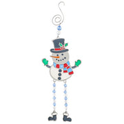 A stained glass style Christmas snowman decoration with a dark blue top hat and holly, red and blue striped scarf, green mittens and dangly blue and clear bead legs with boot charms, on a white background