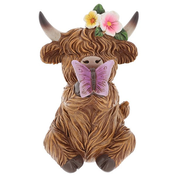 Garden Bloom Highland Cow ornament with floral crown and purple butterfly, on a white background