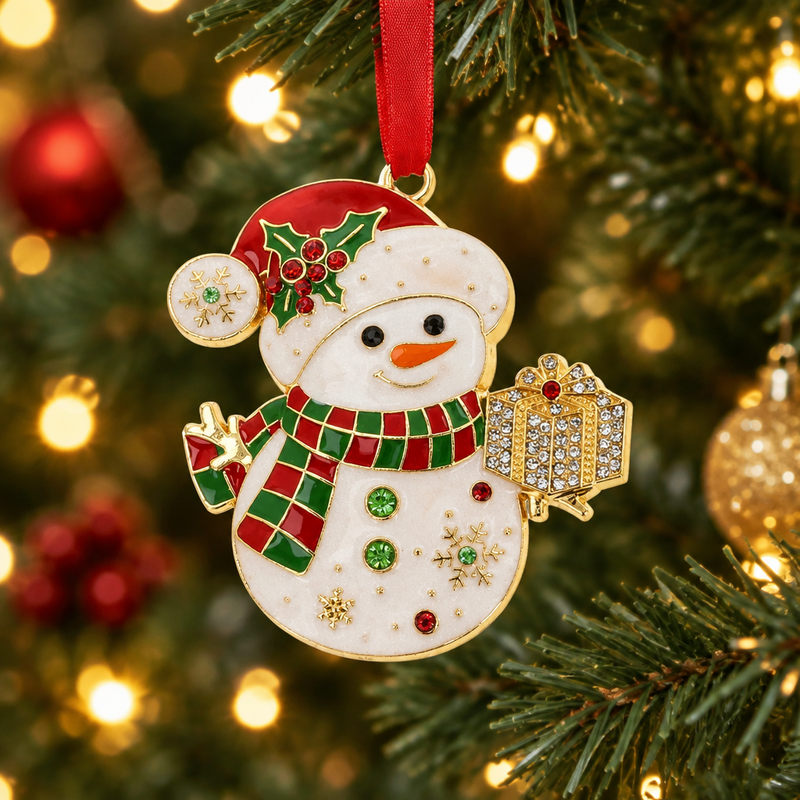 Snowman Christmas tree hanging decoration with Santa hat and crystal-effect gift box, hanging on a Christmas tree with warm golden bokeh fairy lights