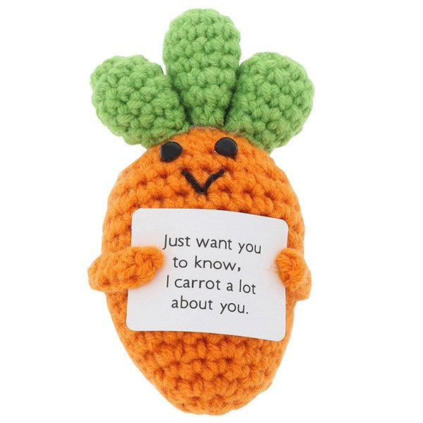 Cheery Crochet Carrot, handmade crochet vegetable character, presented on a white background