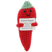 Cheery Crochet Positive Pepper, handmade crochet vegetable character, presented on a white background