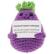 Cheery Crochet Emotional Support Aubergine, handmade crochet vegetable character, presented on a white background