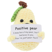 Cheery Crochet Positive Pear, handmade crochet fruit character, presented on a white background