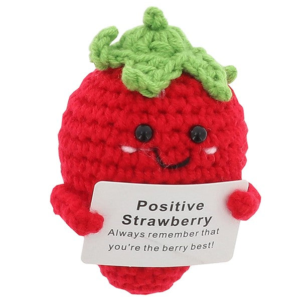 Cheery Crochet Positive Strawberry, handmade crochet fruit character, presented on a white background