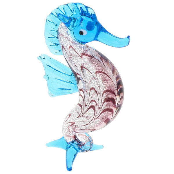 Glass seahorse figurine in blue, presented on a white background