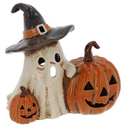 Village Pottery ghost and pumpkins tealight holder — friendly ghost in a witch's hat with orange buckle band, flanked by two carved jack-o'-lantern pumpkins with cut-out features