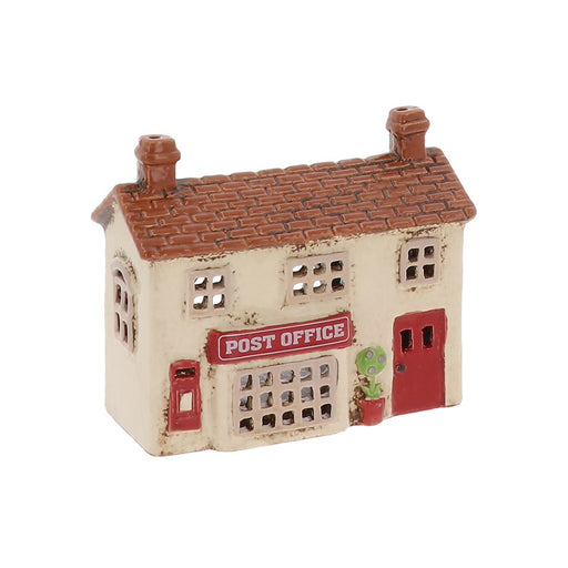 Village Pottery Post Office ceramic tealight holder with red door, red post box and chimney stacks, front view on white background