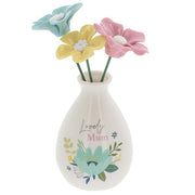 Bright Blooms Lovely Mum white ceramic bud vase with three pastel flowers in blue, yellow and pink, with floral design and sentiment on the front