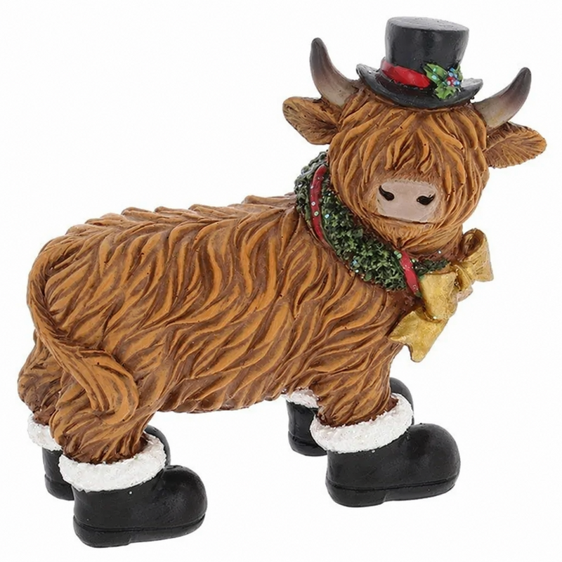 Merry Christmas Coos in Boots highland cow figurine wearing a black top hat with holly, holly wreath with gold bow, and black boots with white fluffy trim