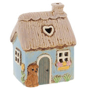 Village Pottery Garden Thatched Blue Cottage ceramic tealight holder with golden puppy, heart roof cut-out window and a flower window box
