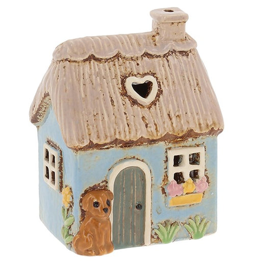 Village Pottery Garden Thatched Blue Cottage ceramic tealight holder with golden puppy, heart roof cut-out window and a flower window box