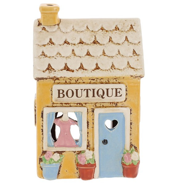 Village Pottery Boutique ceramic tea light holder, buttercup yellow exterior with scalloped cream tiled roof and yellow chimney, front view