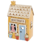 Village Pottery Boutique ceramic tea light holder angled view showing side window detail and scalloped roof