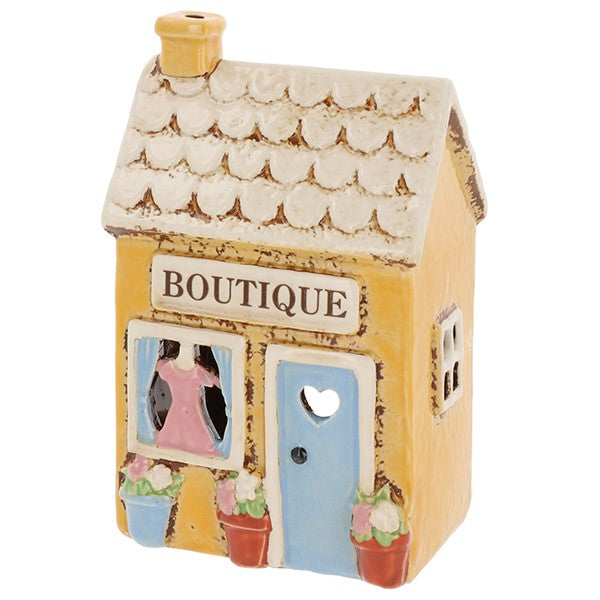 Village Pottery Boutique ceramic tea light holder angled view showing side window detail and scalloped roof