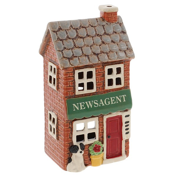 Angled view of Village Pottery newsagent tea light holder showing terracotta chimney, slate roof detail and brick-effect exterior