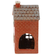 Rear view of Village Pottery newsagent tea light holder showing cut-out arch for tea light access and brick-effect walls
