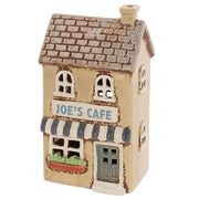 Angled view of Village Pottery Joe's Cafe tea light holder showing chimney, arched upper windows and brick-effect roof detail