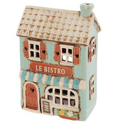 Angled view of Village Pottery Le Bistro tea light holder showing teal chimney and flower box detail