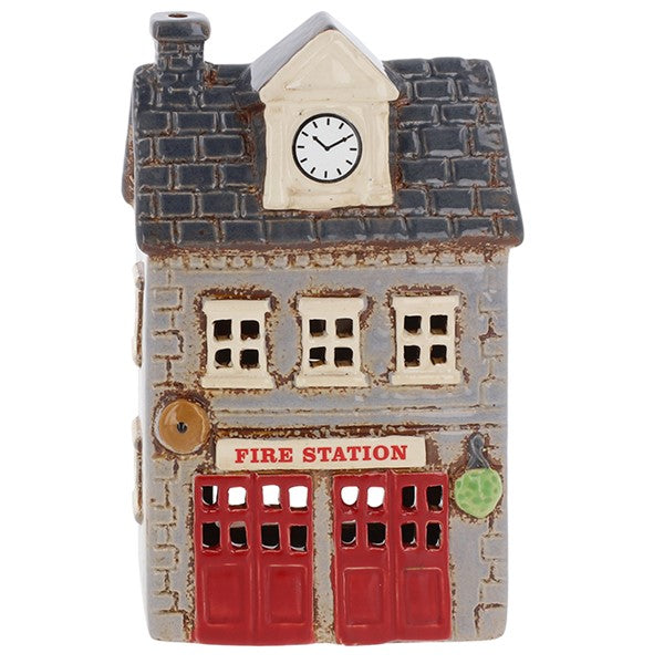 Village Pottery ceramic fire station tea light holder, grey stone brick-effect building with dark slate roof, clock tower, two red garage doors and Fire Station signage