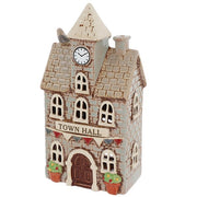 Three-quarter view of Village Pottery town hall tea light holder showing full building detail, Town Hall signage and bunting