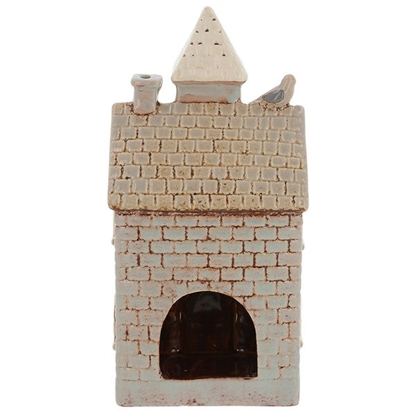 Rear view of Village Pottery town hall tea light holder showing cut-out arch for tea light access and pointed tower detail