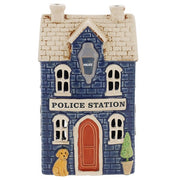 Village Pottery ceramic police station tea light holder, navy blue brick-effect building with stone roof, terracotta arched door, hanging police lantern and golden dog by the door