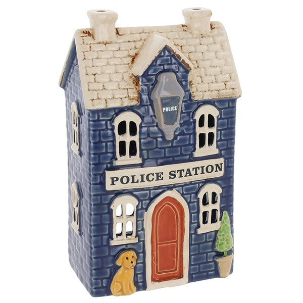 Three-quarter view of Village Pottery police station tea light holder showing full building detail and Police Station signage