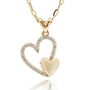 Equilibrium gold plated Heart Duo necklace with a sparkling open-heart pendant and a smaller polished heart