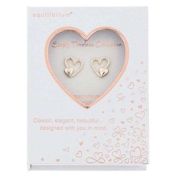 Equilibrium Heart Duo stud earrings displayed in a Simply Timeless Collection presentation box