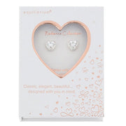 Equilibrium heart stud earrings displayed in a Radiance Collection presentation box