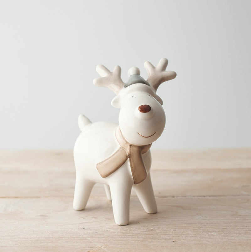 Standing reindeer Christmas decoration in a neutral finish with red nose, little grey hat, scarf and antlers, 15cm tall⠋


