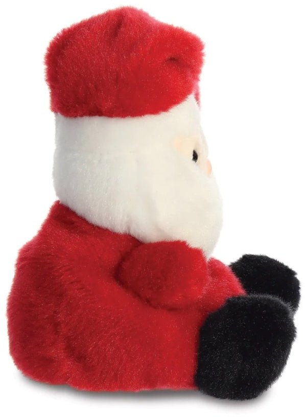 Side view of the Santa Claus Palm Pal showing the red suit dark fluffy feet and red hat with white trim