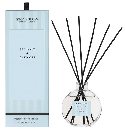 Stoneglow Modern Classics Sea Salt and Oakmoss Reed Diffuser in globe glass vessel with black reeds, shown with pale blue gift box