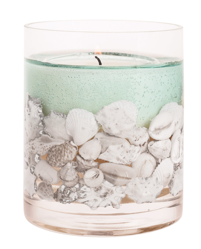 Close-up of Stoneglow Nature's Gift Ocean gel tumbler candle showing seashells and natural wax blend