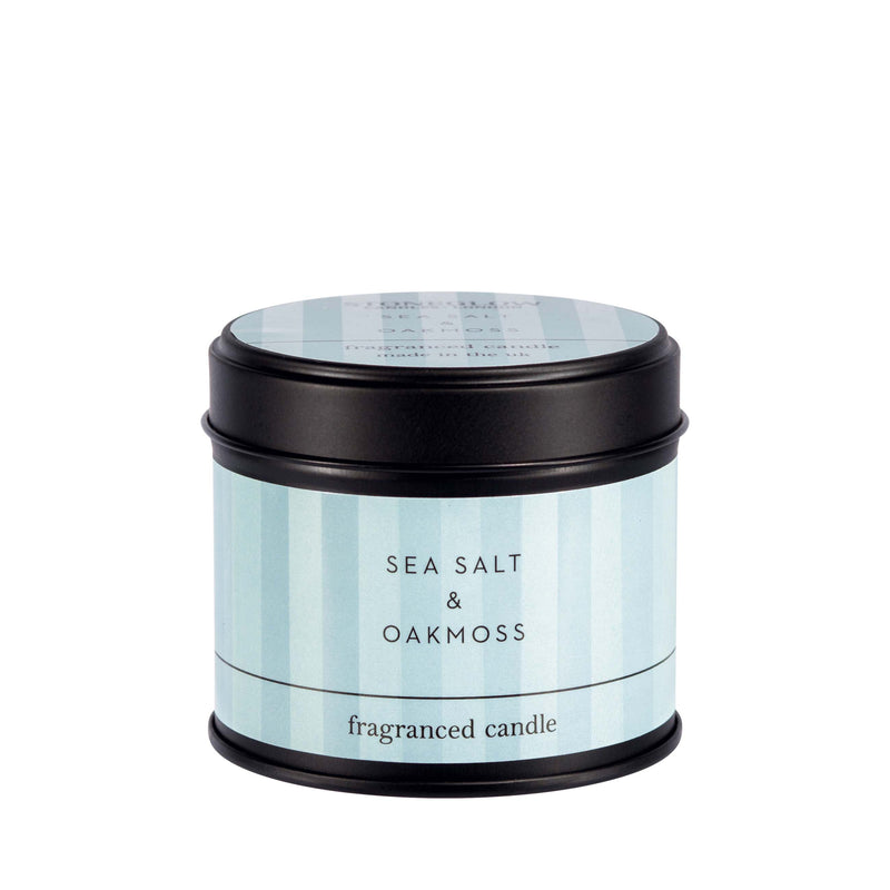 Stoneglow Modern Classics Sea Salt and Oakmoss black candle tin with pale blue label, lid on, shown on white background