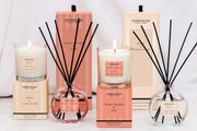 Stoneglow Modern Classics Sweet Orange and Oud and Orris and Ylang Ylang reed diffuser and candle styled together