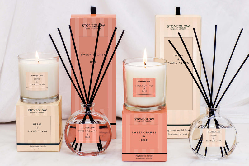 Stoneglow Modern Classics Sweet Orange and Oud and Orris and Ylang Ylang reed diffuser and candle styled together